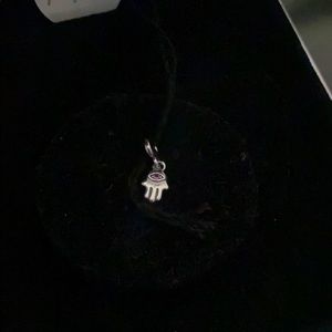 Hamsa hand with purple gem